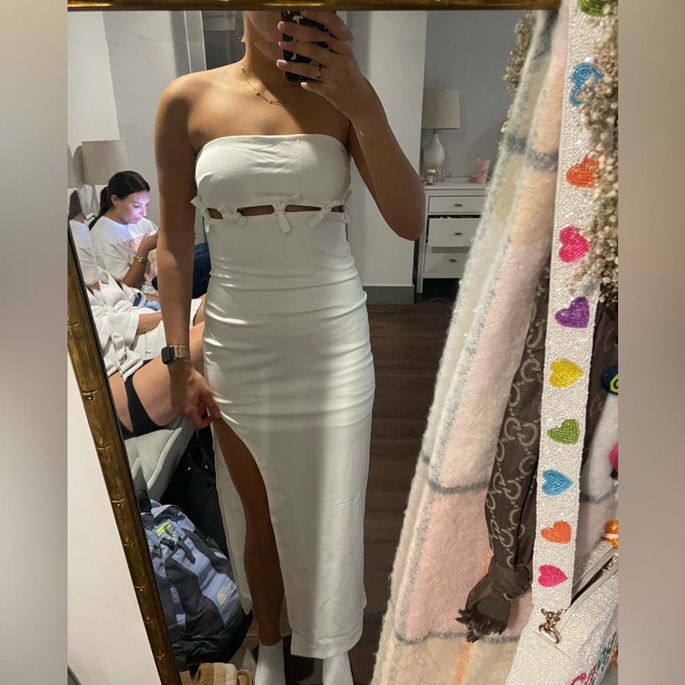 Saints and Secrets White Midi Dress with cutout detail and slit in the leg